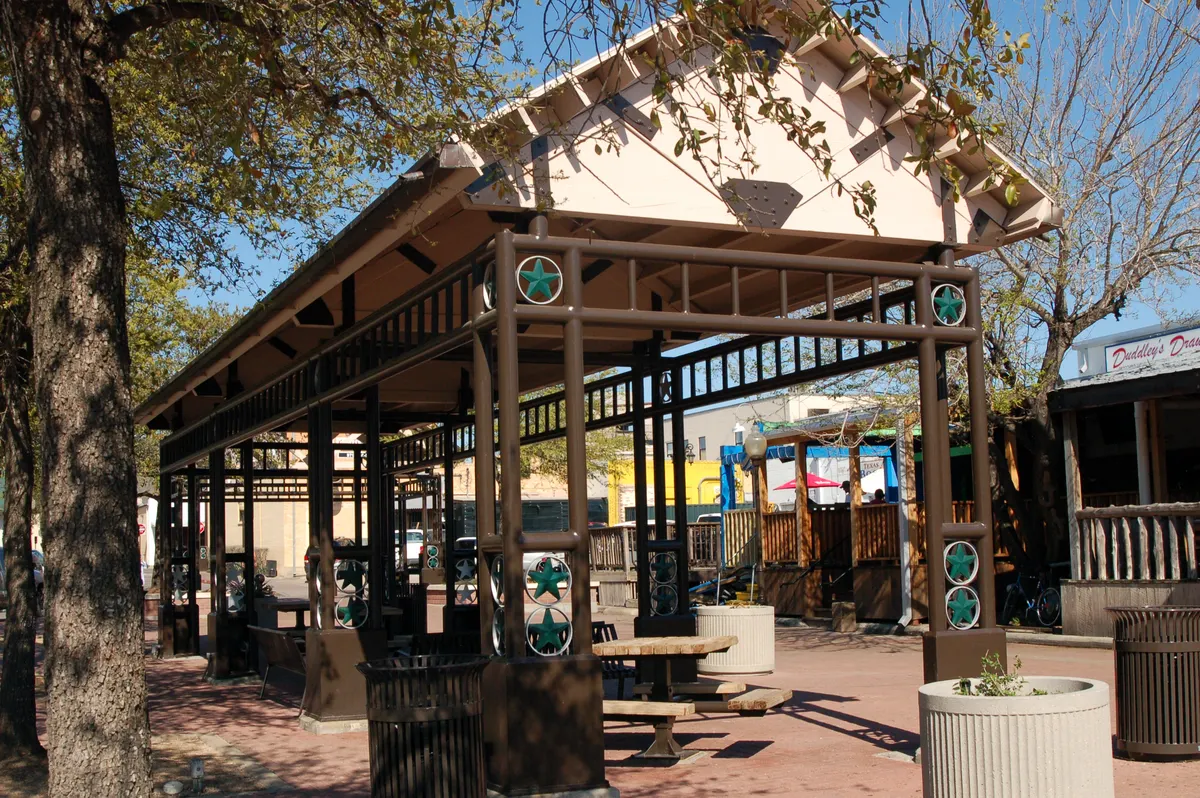 Northgate plaza pavilion with storefronts behind it in College Station